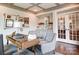 Inviting office area with custom shelving, a bar area, and plenty of natural light at 1018 Heritage Pointe # 302, Indian Trail, NC 28079