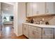 Pantry features custom cabinetry, a wine wrack and quartz countertops at 1018 Heritage Pointe # 302, Indian Trail, NC 28079