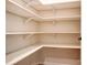 A well-organized walk-in closet features ample shelving for storage and organization at 1018 Heritage Pointe # 302, Indian Trail, NC 28079