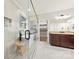 Spa-like bathroom boasting a soaking tub, dark cabinets, and granite counters at 110 Kingsdown Ave, Charlotte, NC 28270