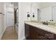 Bathroom features a tiled shower, a dark vanity with granite counters, and ample lighting at 110 Kingsdown Ave, Charlotte, NC 28270