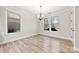 Bright dining room with windows and a modern chandelier at 110 Kingsdown Ave, Charlotte, NC 28270