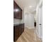 Hallway featuring dark wood cabinets and trim, as well as an elegant archway at 110 Kingsdown Ave, Charlotte, NC 28270