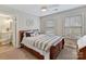 Comfortable bedroom featuring two windows, a ceiling fan, and carpeted floors at 1110 Woodhall Dr, Huntersville, NC 28078