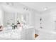 Well-lit bathroom with double vanity, large mirror, and separate tub/shower at 11320 Joe Morrison Ln, Charlotte, NC 28214