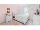 Cozy bedroom is adorned with soft pink accents and plush textures at 11320 Joe Morrison Ln, Charlotte, NC 28214