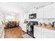 Well-equipped kitchen with white cabinets, and modern appliances at 11320 Joe Morrison Ln, Charlotte, NC 28214