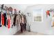 Bright walk-in closet with custom shelving for optimal storage and organization at 11320 Joe Morrison Ln, Charlotte, NC 28214