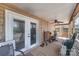 Covered back porch with ceiling fan, exercise equipment, and a view of the backyard at 116 S Westover Dr, Monroe, NC 28112