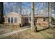 Charming single-story home featuring a cozy front porch and well-maintained landscaping at 116 S Westover Dr, Monroe, NC 28112