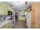 The spacious kitchen features modern appliances, plenty of counter space, and ample storage at 116 S Westover Dr, Monroe, NC 28112