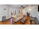 Bright living room features French doors, hardwood flooring, and neutral colors at 116 S Westover Dr, Monroe, NC 28112