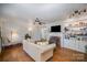 Spacious living room featuring hardwood floors, fireplace, and built-in shelving at 116 S Westover Dr, Monroe, NC 28112
