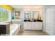 Bathroom features a soaking tub and a double vanity at 121 Asmodean Ln, Troutman, NC 28166