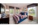 Comfortable bedroom featuring two windows with shades for natural lighting and a closet at 121 Asmodean Ln, Troutman, NC 28166