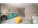 Spacious bonus room features a sofa, ottoman, and a desk space at 121 Asmodean Ln, Troutman, NC 28166