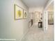 This hallway has neutral carpet and walls, and connects several rooms at 121 Asmodean Ln, Troutman, NC 28166
