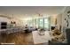 Bright and open living room featuring a fireplace, hardwood floors, and ample natural light at 121 Asmodean Ln, Troutman, NC 28166