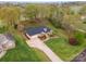 Aerial view of a brick home with a large yard in a residential area at 126 Harbourtown Dr, Kings Mountain, NC 28086