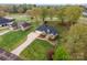 Beautiful aerial view of a single Gathering home featuring a large yard and mature trees at 126 Harbourtown Dr, Kings Mountain, NC 28086
