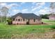 Well-maintained backyard featuring a spacious deck perfect for relaxing and entertaining at 126 Harbourtown Dr, Kings Mountain, NC 28086