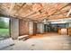 Unfinished basement with exposed brick, beams and duct work, with access to the outdoors at 126 Harbourtown Dr, Kings Mountain, NC 28086