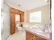 Bathroom with a double vanity, bathtub, walk-in shower and wooden cabinets at 126 Harbourtown Dr, Kings Mountain, NC 28086