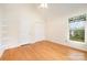 Well-lit bedroom with hardwood floors, a vaulted ceiling, and large window with window-seat at 126 Harbourtown Dr, Kings Mountain, NC 28086
