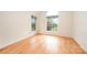 A simple bedroom with hardwood floors and a large window providing abundant natural light at 126 Harbourtown Dr, Kings Mountain, NC 28086