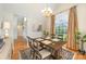 Elegant dining room with hardwood floors, a decorative chandelier, and large window with natural light at 126 Harbourtown Dr, Kings Mountain, NC 28086