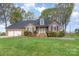 Charming brick home featuring a well-manicured lawn, attached garage, and inviting front entrance at 126 Harbourtown Dr, Kings Mountain, NC 28086