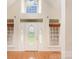 Bright foyer with a soaring window, a beautiful front door, and hardwood floors at 126 Harbourtown Dr, Kings Mountain, NC 28086