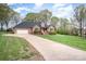 Charming brick home with a two-car garage, long driveway, and mature trees at 126 Harbourtown Dr, Kings Mountain, NC 28086
