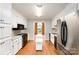 Functional kitchen with white cabinets, black appliances, and a kitchen island at 126 Harbourtown Dr, Kings Mountain, NC 28086