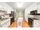 Efficient kitchen with white cabinets, stainless steel refrigerator, and a central island at 126 Harbourtown Dr, Kings Mountain, NC 28086