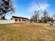 Charming ranch-style home with a well-manicured front yard and red shutters at 1313 Ridgewood Dr, Concord, NC 28027