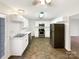 Bright kitchen featuring white cabinetry, stainless steel appliances, and vinyl floors at 1313 Ridgewood Dr, Concord, NC 28027
