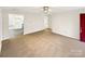 Bright living room with neutral carpet and a view into the adjacent kitchen at 1313 Ridgewood Dr, Concord, NC 28027