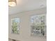 Sunlight streams through the two windows of the bedroom at 1317 Queen Lyon Ct, Charlotte, NC 28205