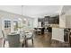 Stylish kitchen with dark cabinets, granite countertops, stainless steel appliances, and breakfast bar seating at 1317 Queen Lyon Ct, Charlotte, NC 28205