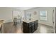 Stylish kitchen with dark cabinets, granite countertops, stainless steel appliances, and breakfast bar seating at 1317 Queen Lyon Ct, Charlotte, NC 28205