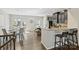 Stylish kitchen with dark cabinets, granite countertops, stainless steel appliances, and breakfast bar seating at 1317 Queen Lyon Ct, Charlotte, NC 28205