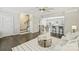 Spacious living room features dark hardwood floors, stairs, an open floor plan and a view to a dining area at 1317 Queen Lyon Ct, Charlotte, NC 28205