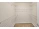 Walk-in closet offering wire shelving units perfect for keeping all of your clothing organized at 1317 Queen Lyon Ct, Charlotte, NC 28205