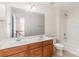 Bathroom featuring a double sink vanity, combination shower and bathtub, and toilet at 1615 Jekyll Ln, Waxhaw, NC 28173