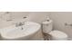 Half bathroom showing white sink and toilet at 1615 Jekyll Ln, Waxhaw, NC 28173