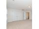 Bedroom featuring neutral walls, carpet, a double-door closet, and a doorway at 1615 Jekyll Ln, Waxhaw, NC 28173