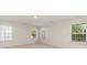 Bedroom featuring neutral walls, carpet, and three windows for natural lighting at 1615 Jekyll Ln, Waxhaw, NC 28173