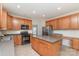 Eat-in kitchen with stainless steel appliances and center island at 1615 Jekyll Ln, Waxhaw, NC 28173
