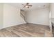 Spacious living room boasts light-toned hardwood flooring and natural light at 1615 Jekyll Ln, Waxhaw, NC 28173